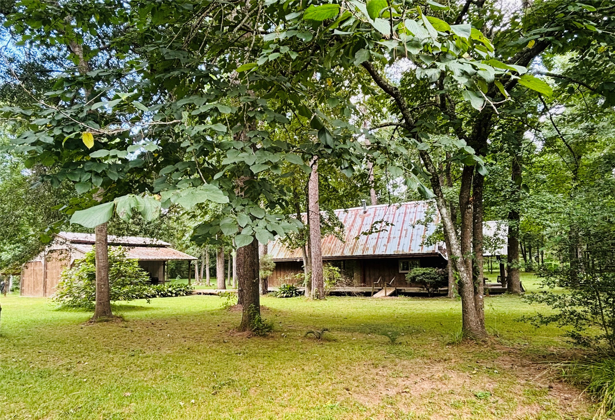 141 Walnut Loop Shepherd, TX 77371 - Photo 3 of 50 Situated in a private setting with lots of animals and trees that make you feel one with nature- sit back and re-charge yourself! If your a writer- this could be your sanctuary!