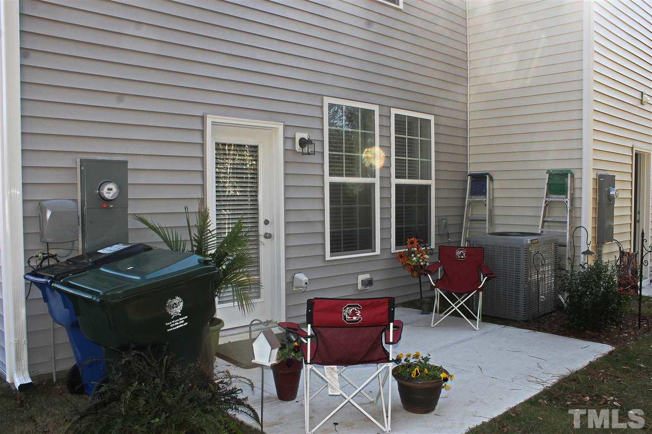3908 Volkswalk Place Raleigh, NC 27610 - Photo 20 of 20 a backyard of a house with outdoor seating