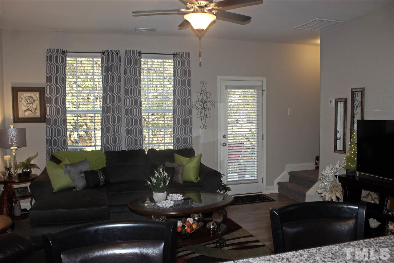 3908 Volkswalk Place Raleigh, NC 27610 - Photo 8 of 20 a living room with furniture and a flat screen tv