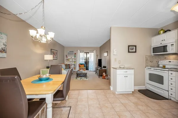 a very nice looking dining room with a table and chairs