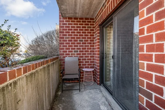 a view of chair with wooden floor and fence