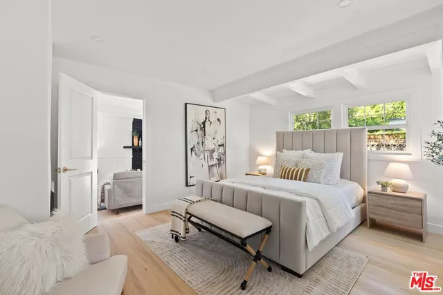 a bedroom with a bed and a couch