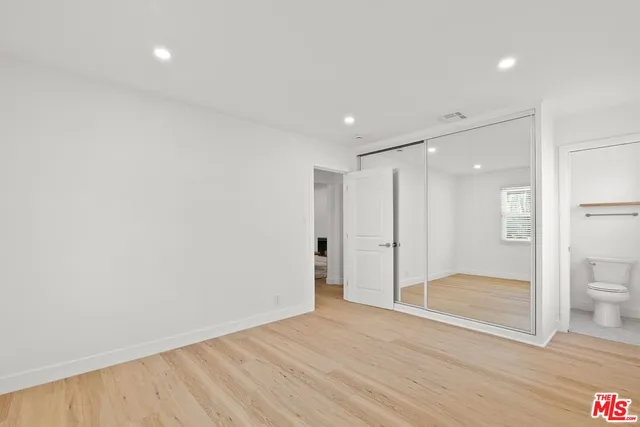 a bathroom with a shower and a glass door