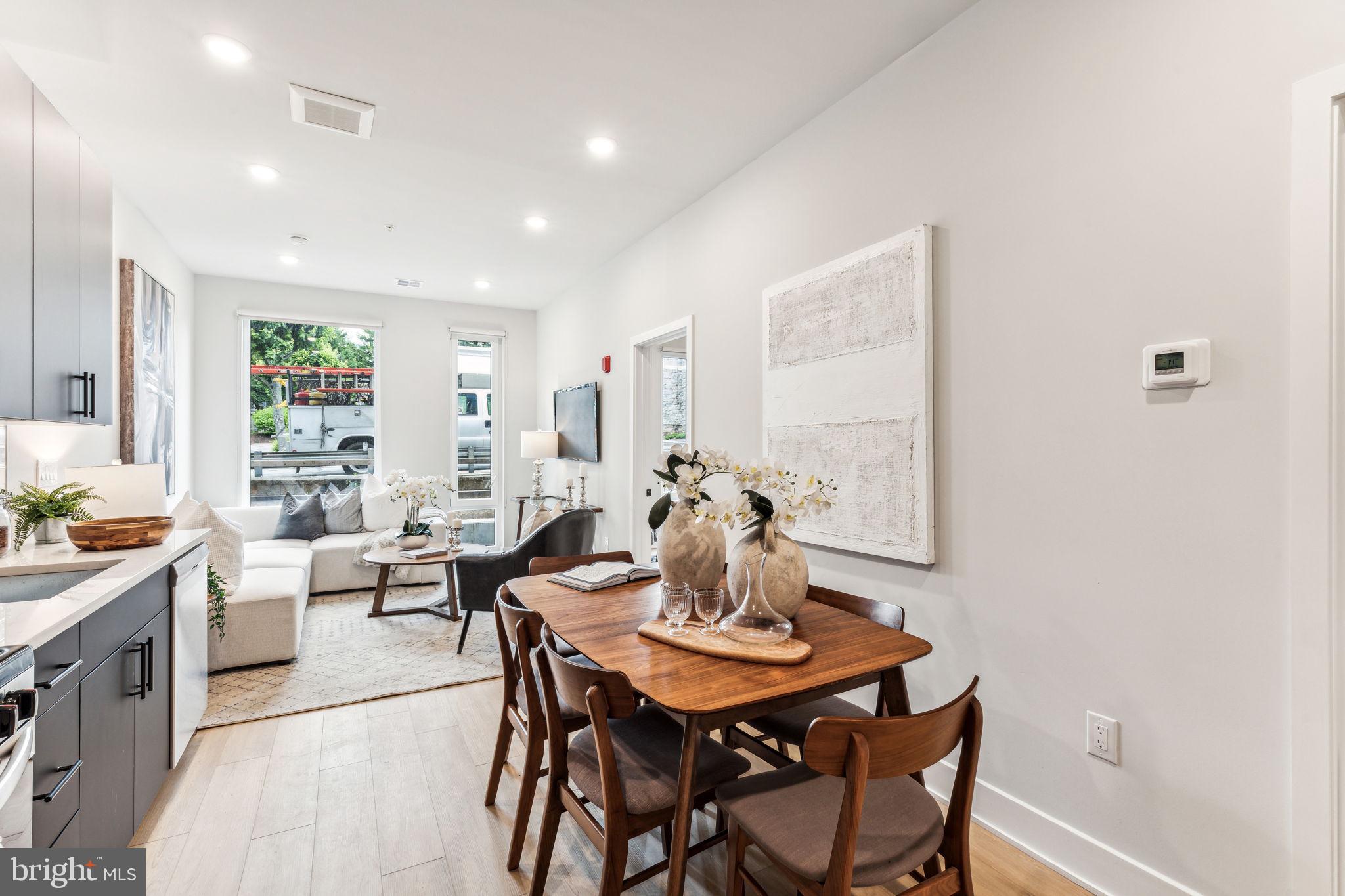 6910 Ridge Avenue, Unit 319 Philadelphia, PA 19128 - Photo 7 of 20 a view of a dining room with furniture