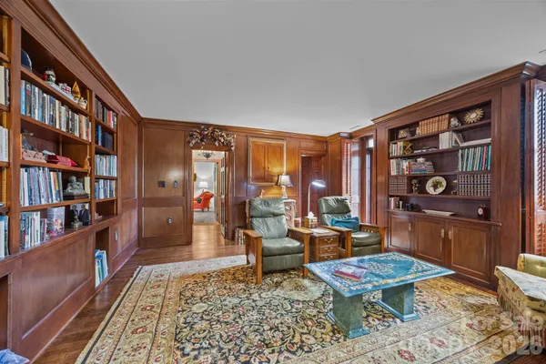 a living room with furniture and bed