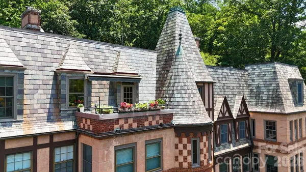 a view of a house with a yard patio and sitting area