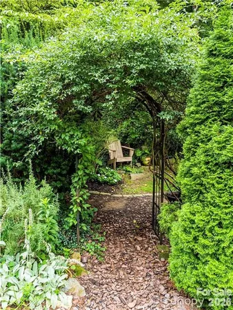 a front view of a residential apartment building with a yard