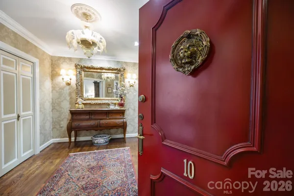 a view of a hallway with furniture