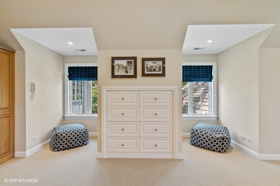 340 Old Farm Road Northfield, IL 60093 - Photo 22 of 50 a room with a bed a dresser and a window