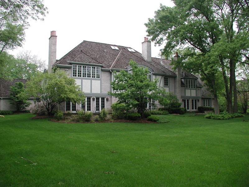 340 Old Farm Road Northfield, IL 60093 - Photo 37 of 50 a view of a house next to a big yard and large trees