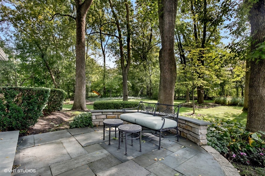 340 Old Farm Road Northfield, IL 60093 - Photo 43 of 50 a backyard of a house with fountain table and chairs