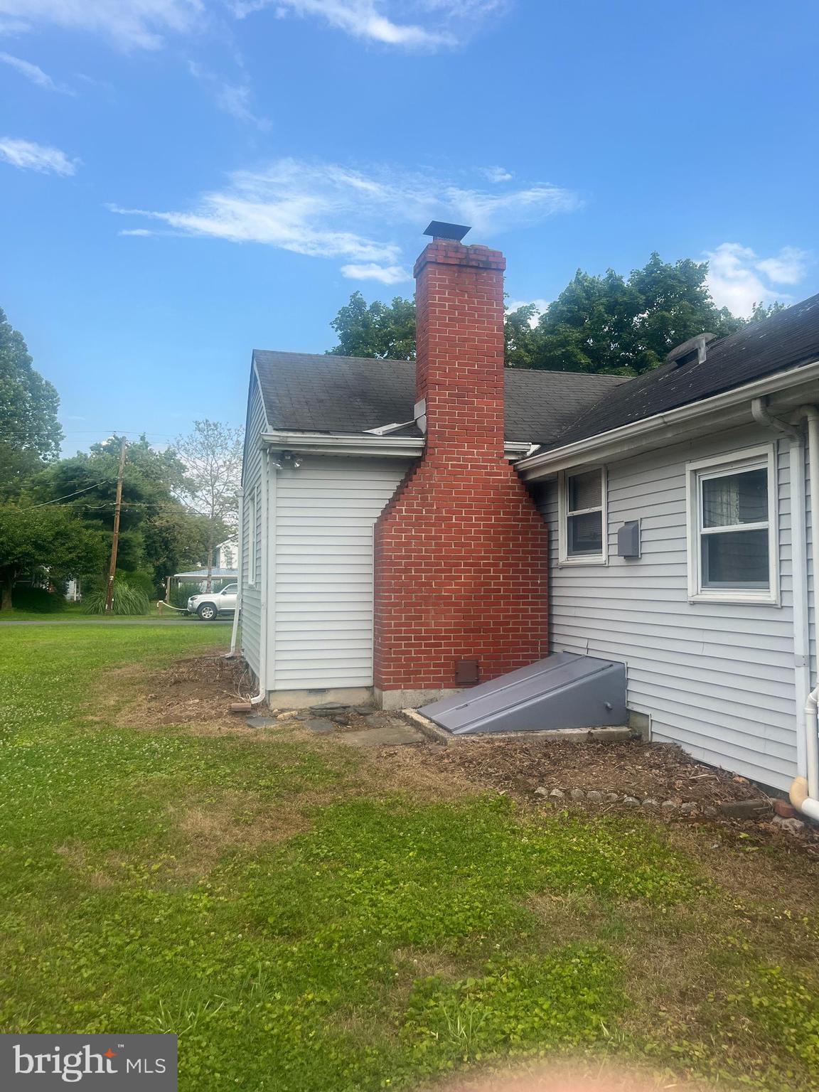 79 Riverview Avenue Earleville, MD 21919 - Photo 9 of 35 a front view of a house with a yard and garage