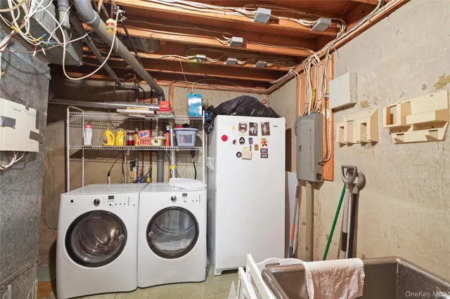 a living room with furniture and a book shelf