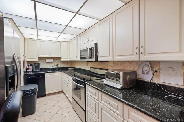 a living room with furniture a couch and a flat screen tv