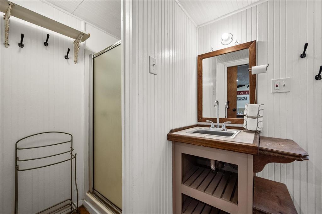 14036 Old Texaco Road Conroe, TX 77302 - Photo 22 of 40 Bathroom with vanity and a shower stall