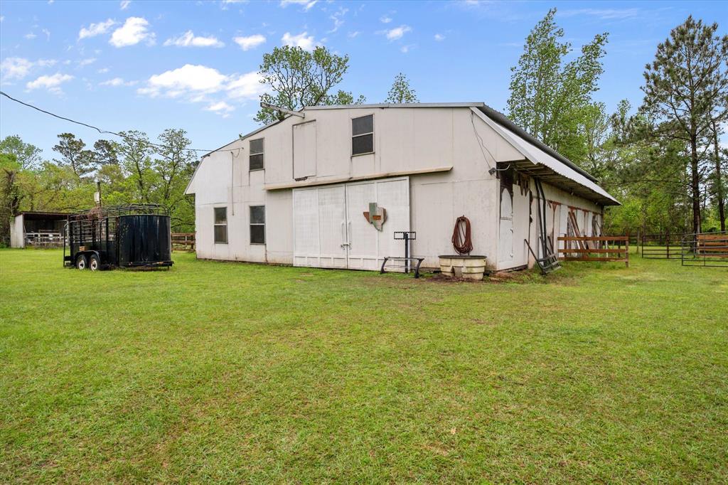 14036 Old Texaco Road Conroe, TX 77302 - Photo 35 of 40 View of outdoor structure with an outbuilding and fence