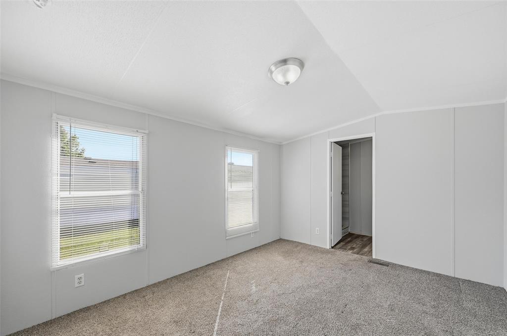 607 Keats Road Wilmer, TX 75172 - Photo 13 of 27 an empty room with windows