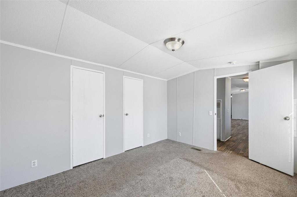 607 Keats Road Wilmer, TX 75172 - Photo 14 of 27 a view of a big room with closet and windows