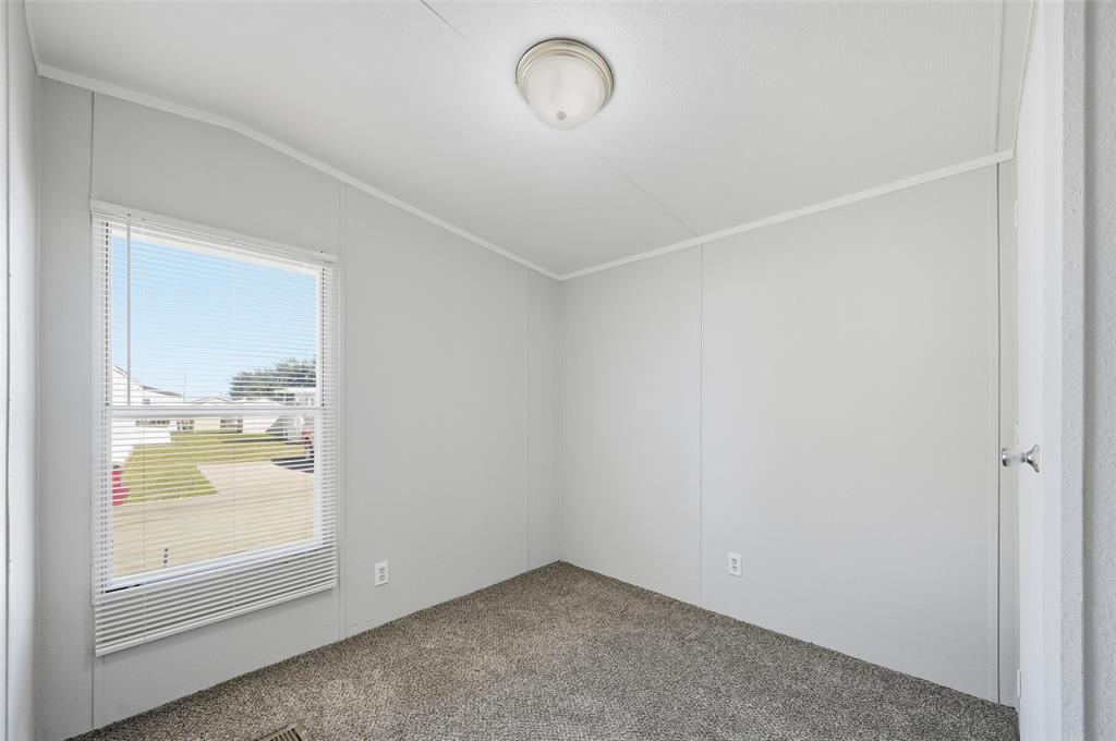 607 Keats Road Wilmer, TX 75172 - Photo 21 of 27 an empty room with a window