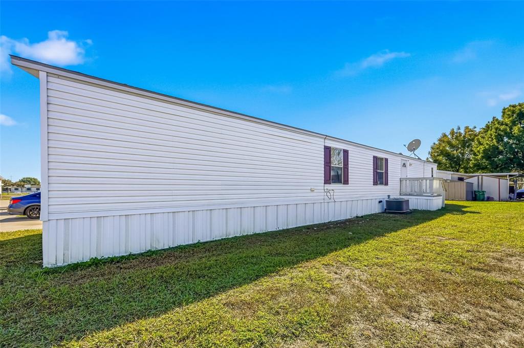 607 Keats Road Wilmer, TX 75172 - Photo 26 of 27 a view of a backyard with plants and a backyard