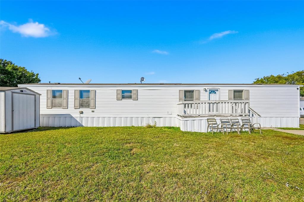 607 Keats Road Wilmer, TX 75172 - Photo 3 of 27 a view of a house with swimming pool and a yard