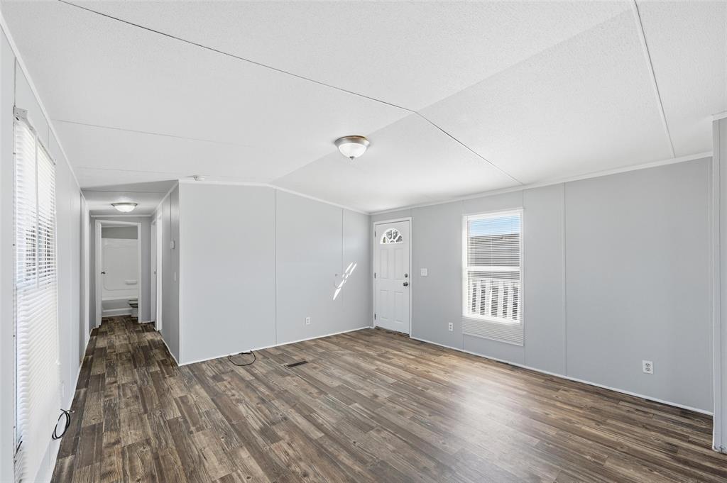 607 Keats Road Wilmer, TX 75172 - Photo 8 of 27 a view of empty room with wooden floor