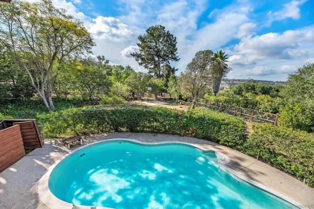 a kitchen with stainless steel appliances granite countertop a sink and a stove