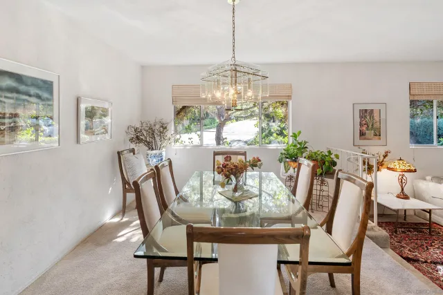 a work room with furniture and a flat screen tv