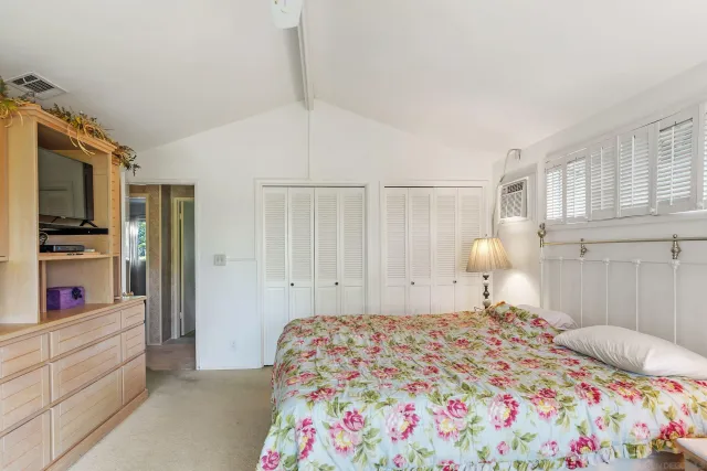 a bathroom with a sink vanity and a mirror