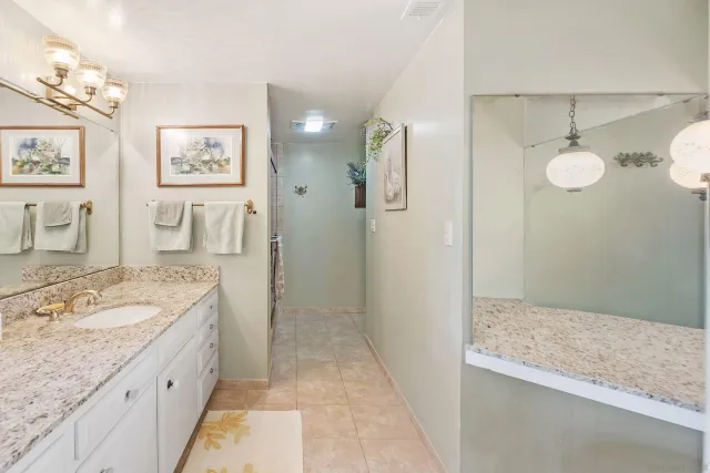 a view of a house with backyard porch and sitting area