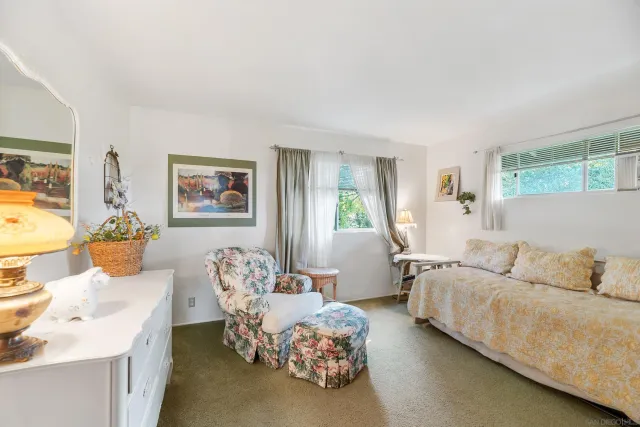 a view of yard with seating area and trees around