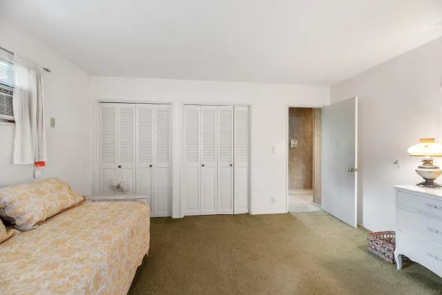 a front view of a house with swimming pool having outdoor seating