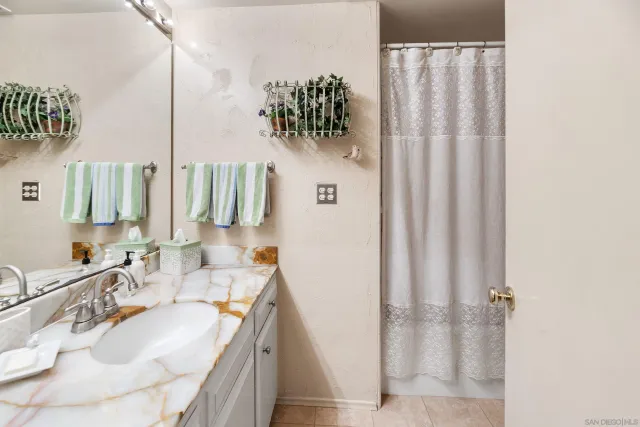 a room that has a bed and a dresser in it