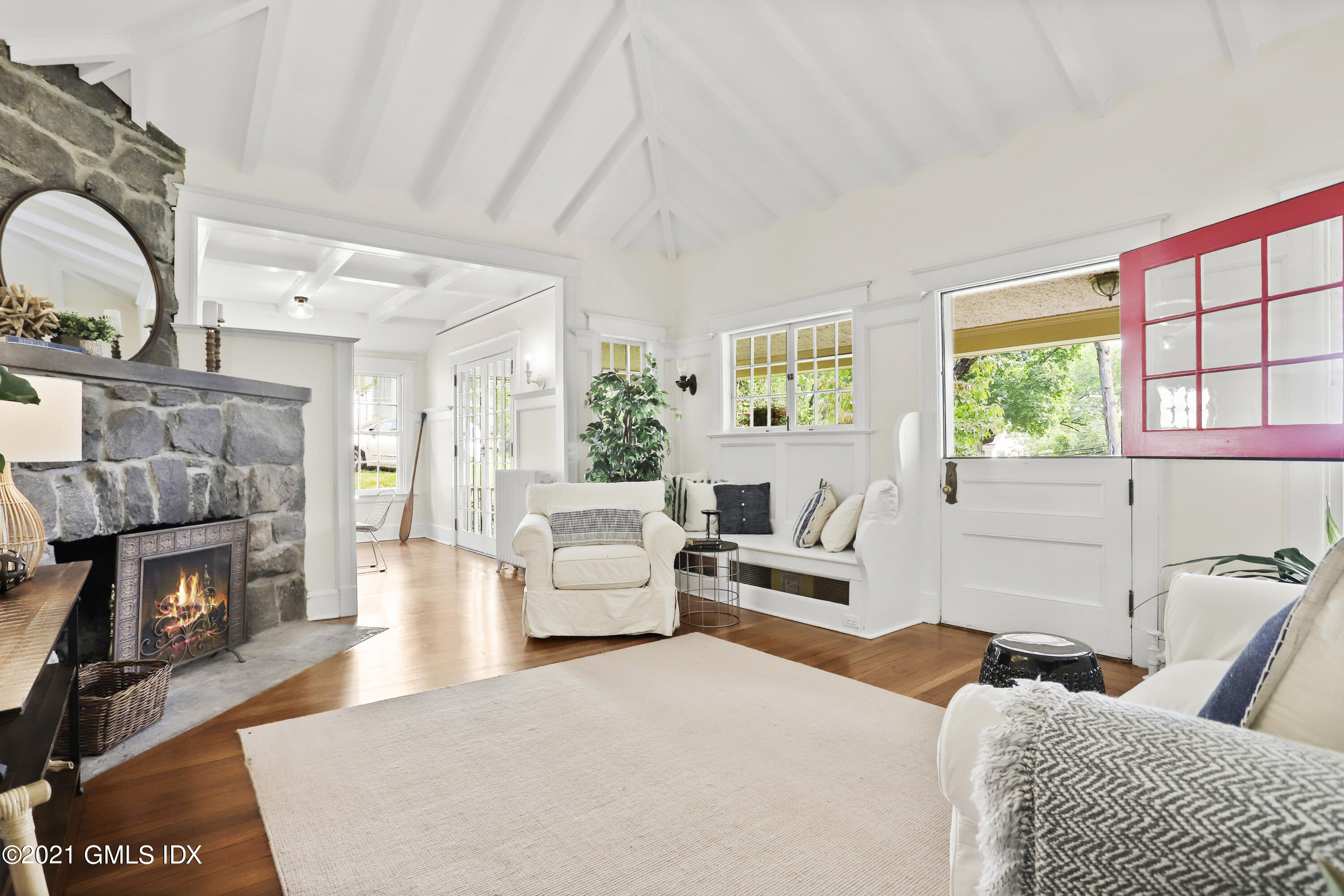 a bedroom with furniture and a fireplace