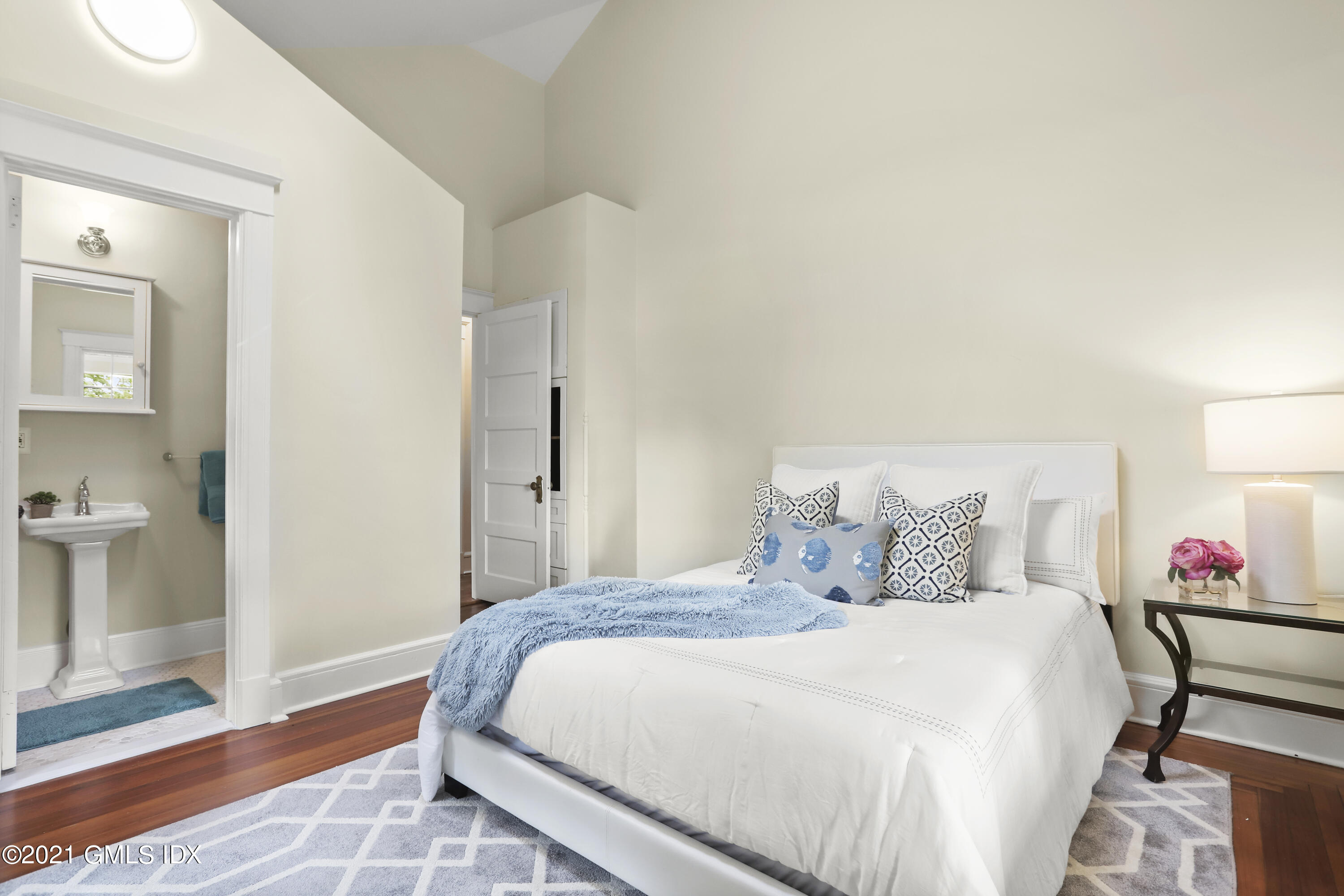 35 Strickland Road Cos Cob, CT 06807 - Photo 17 of 25 a bedroom with a bed and a view of bathroom
