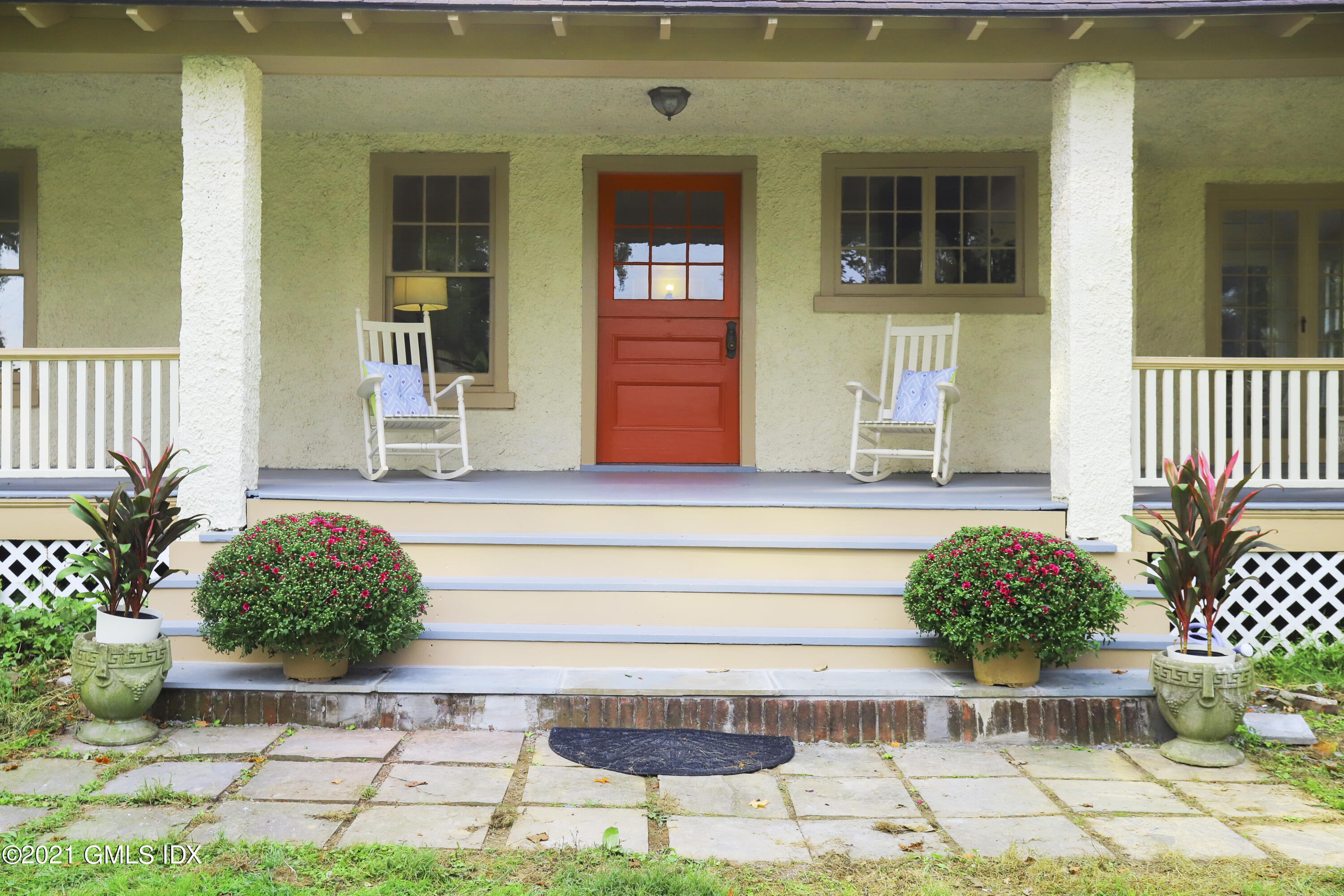 35 Strickland Road Cos Cob, CT 06807 - Photo 2 of 25 a front view of a house having yard