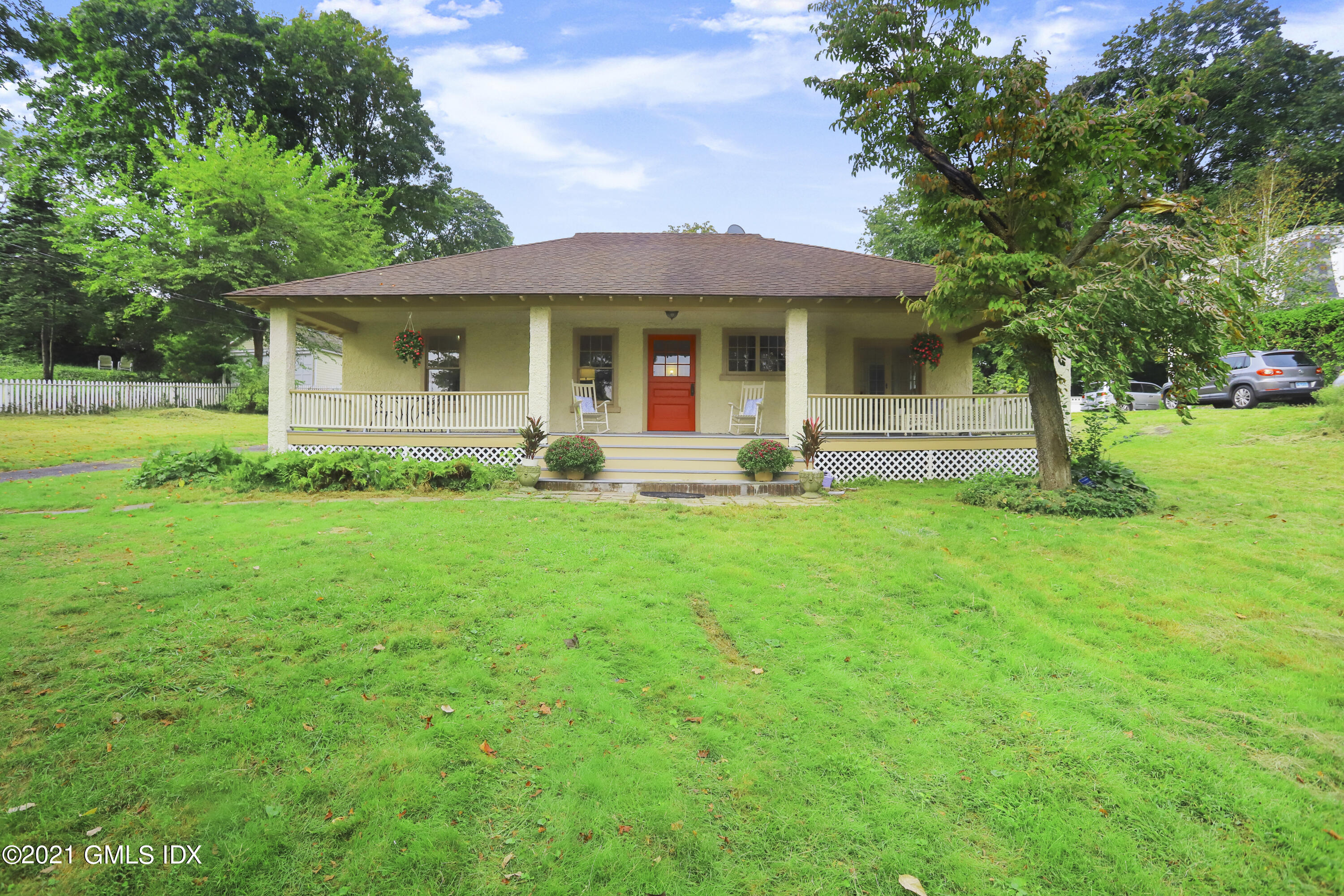 35 Strickland Road Cos Cob, CT 06807 - Photo 3 of 25 a view of a house with a yard and sitting area