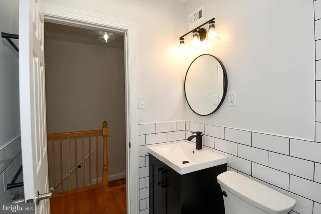 a bathroom with a toilet and a bathtub