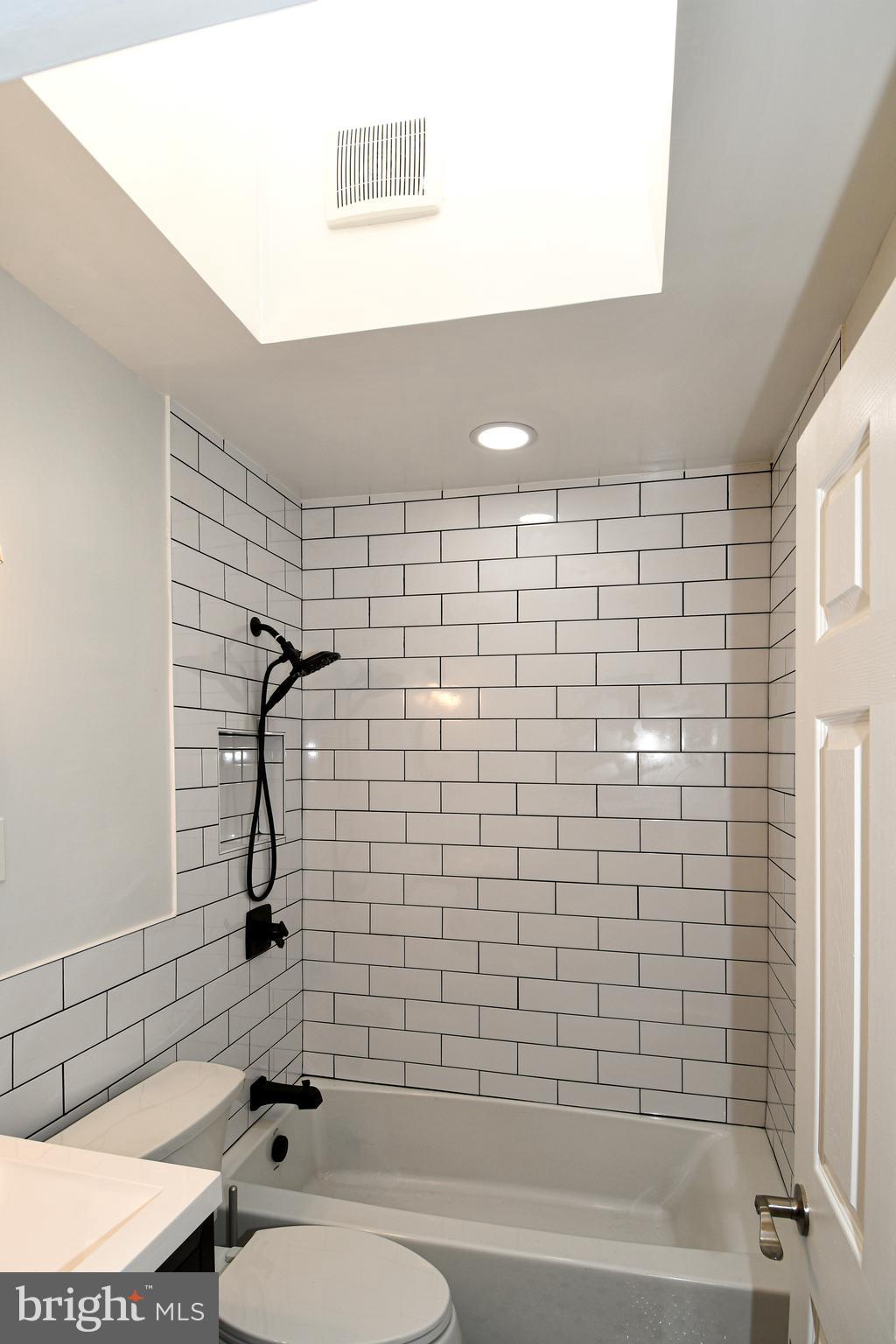 4620 Sargent Road Northeast Washington, DC 20017 - Photo 26 of 34 a bathroom with a toilet and a bathtub