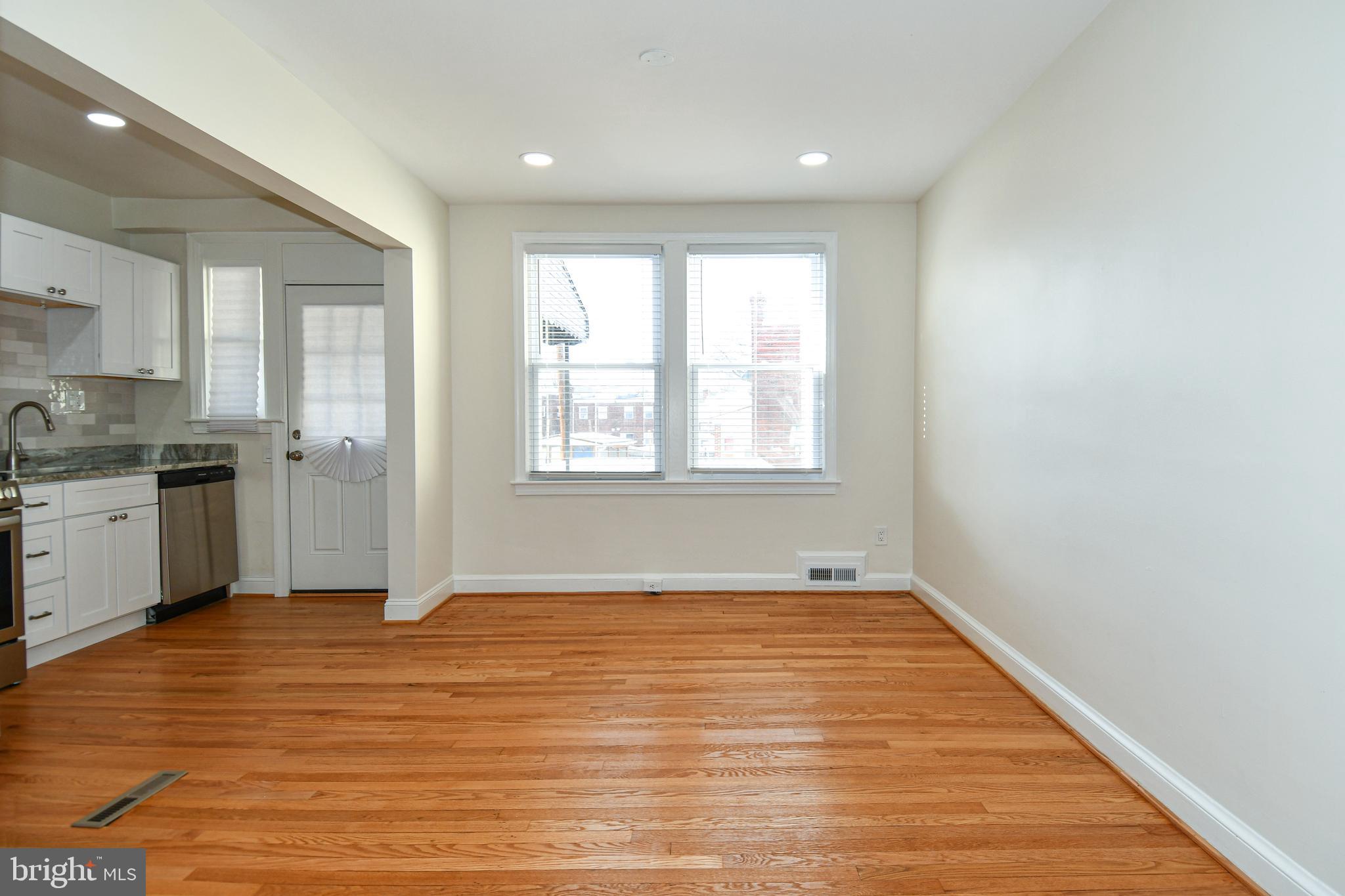4620 Sargent Road Northeast Washington, DC 20017 - Photo 10 of 34 a view of an empty room with window and wooden floor