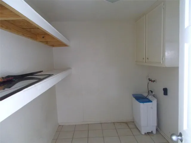 a view of a porch with furniture and next to a yard