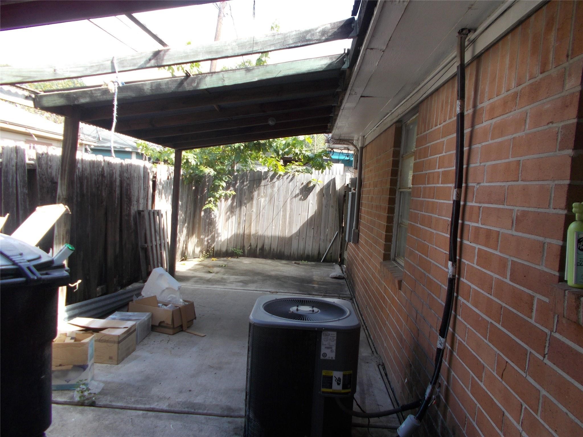 1923 Ojeman Road Houston, TX 77080 - Photo 14 of 14 a view of a porch with furniture and next to a yard