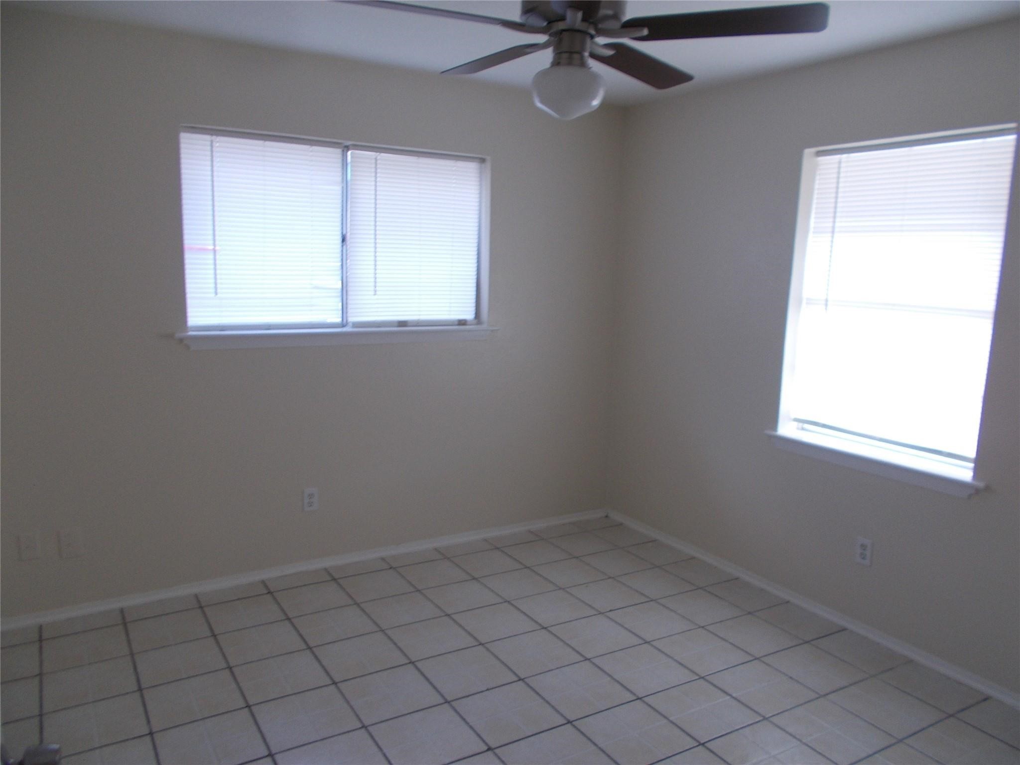 1923 Ojeman Road Houston, TX 77080 - Photo 7 of 14 an empty room with a window