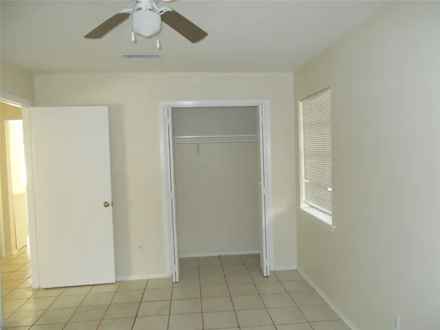 a kitchen with a cabinets and steel stainless steel appliances