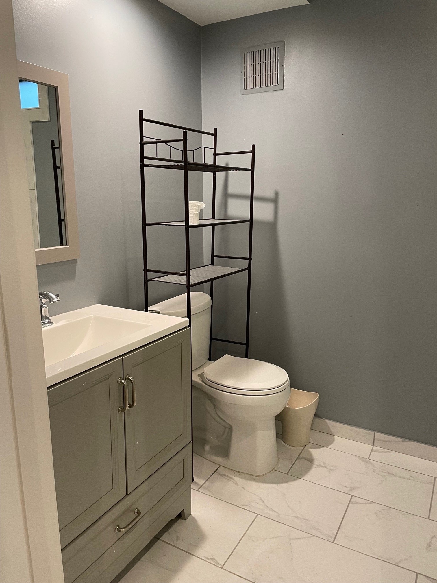 4502 Dickson Street Houston, TX 77007 - Photo 8 of 8 a bathroom with a toilet a sink and mirror