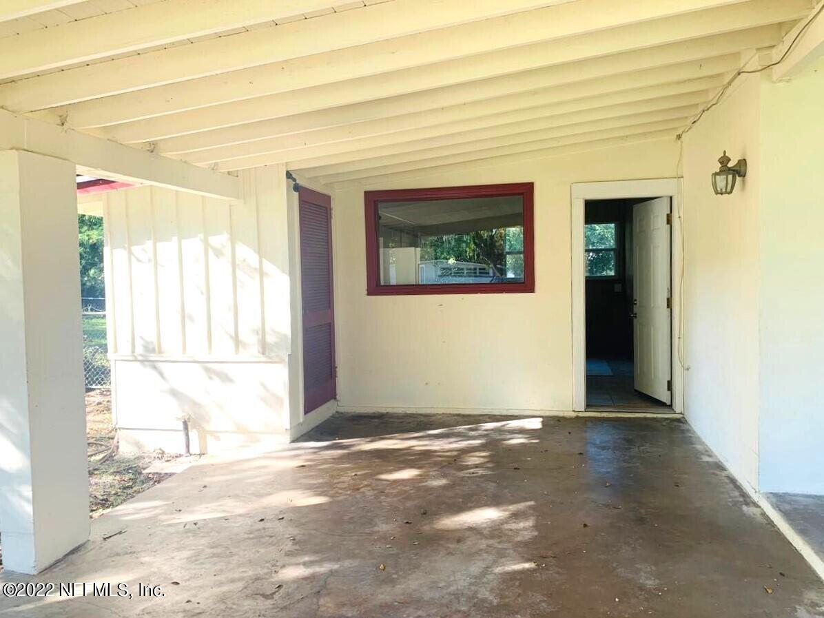7033 Clovis Road Jacksonville, FL 32205 - Photo 7 of 37 covered carport and exterior storage clo