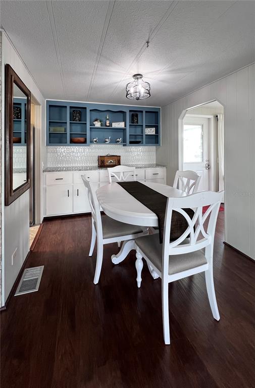 1100 South Belcher Road, Unit 772 Largo, FL 33771 - Photo 13 of 84 a view of a dining room with furniture and wooden floor
