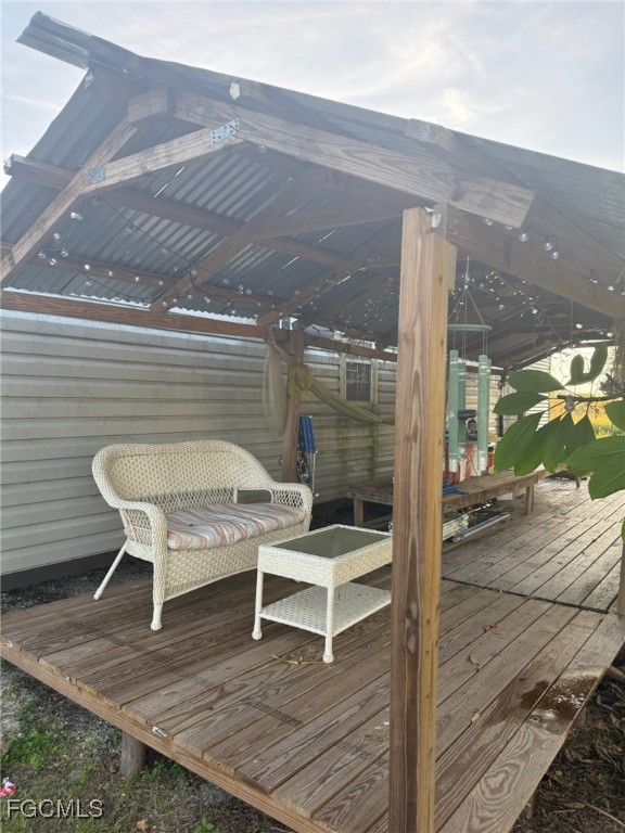 6724 5th Road LaBelle, FL 33935 - Photo 27 of 29 a balcony with chairs and table