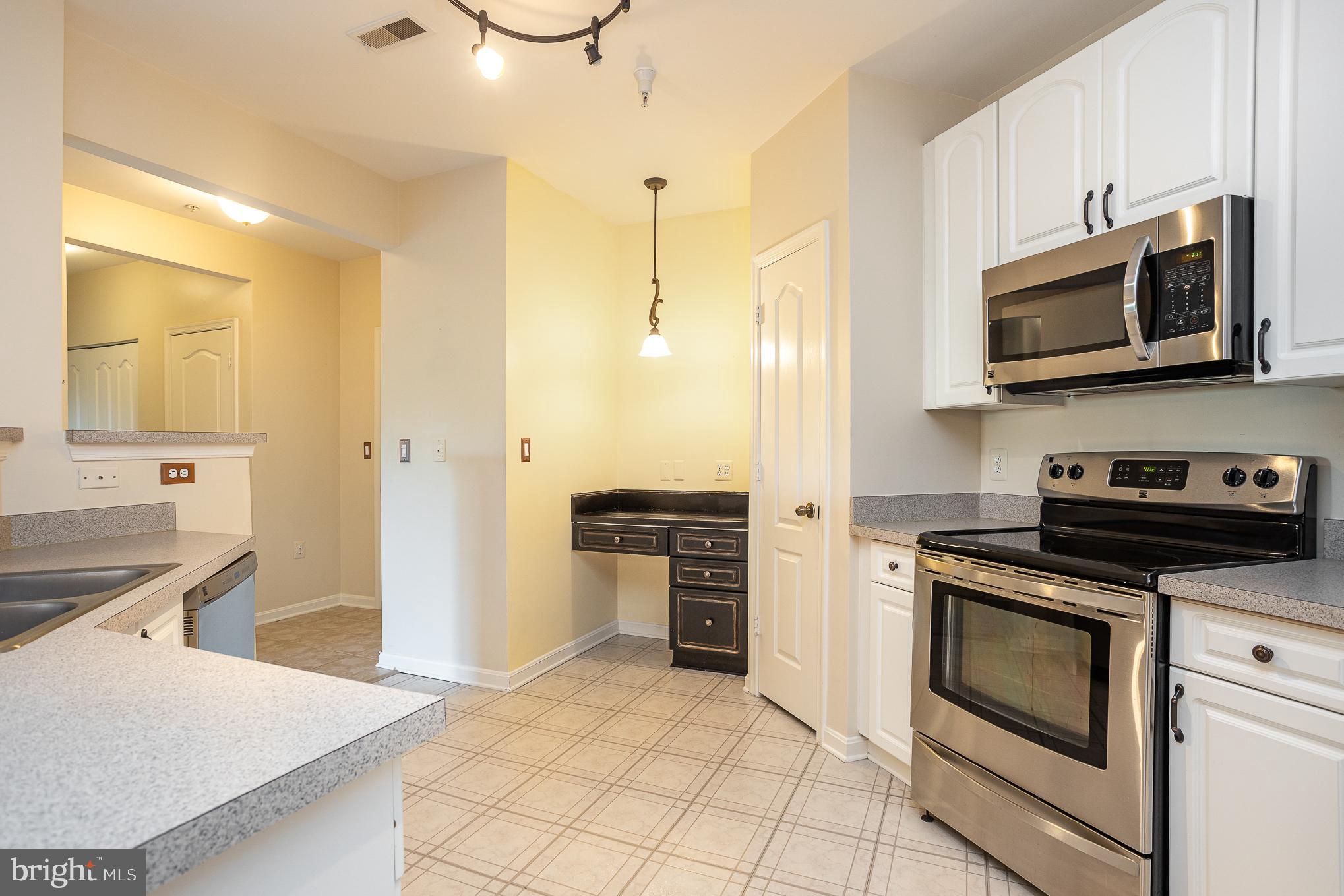 400 Symphony Circle, Unit 350D Cockeysville, MD 21030 - Photo 10 of 24 Kitchen with desk and pantry