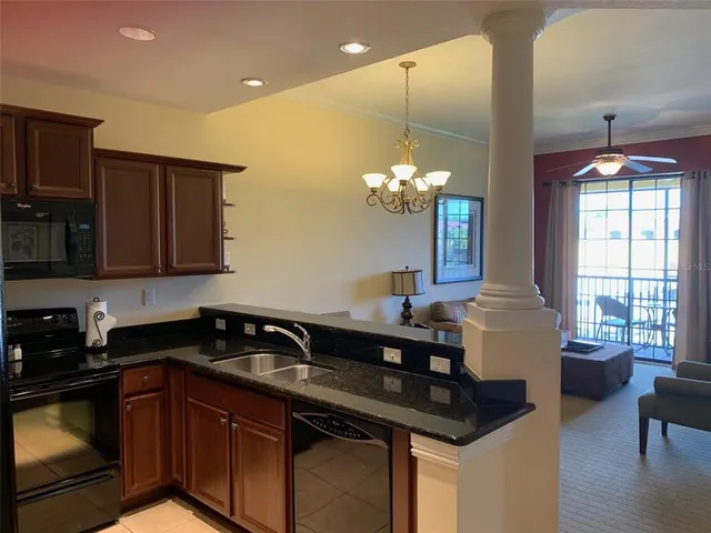 a kitchen that has a sink and cabinets